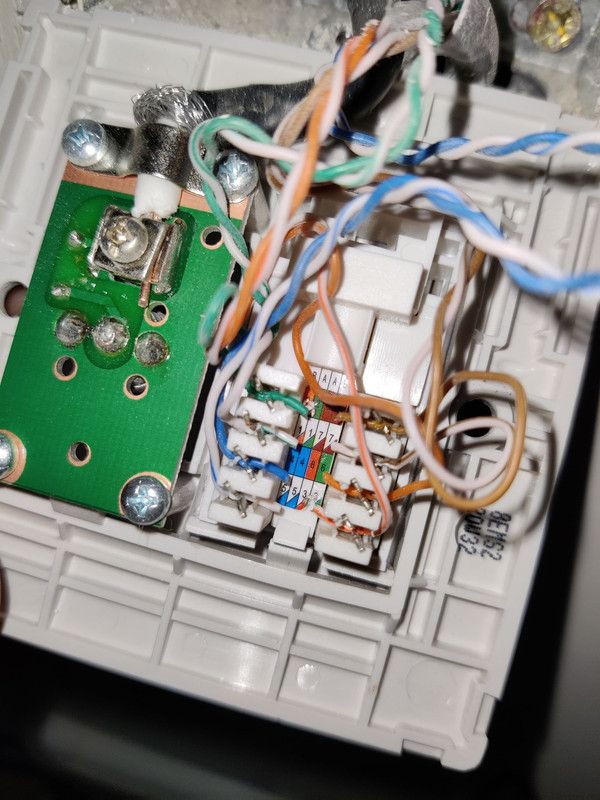 upstairs wiring (its a ethernet and aerial port, hence the green board and copper wire)